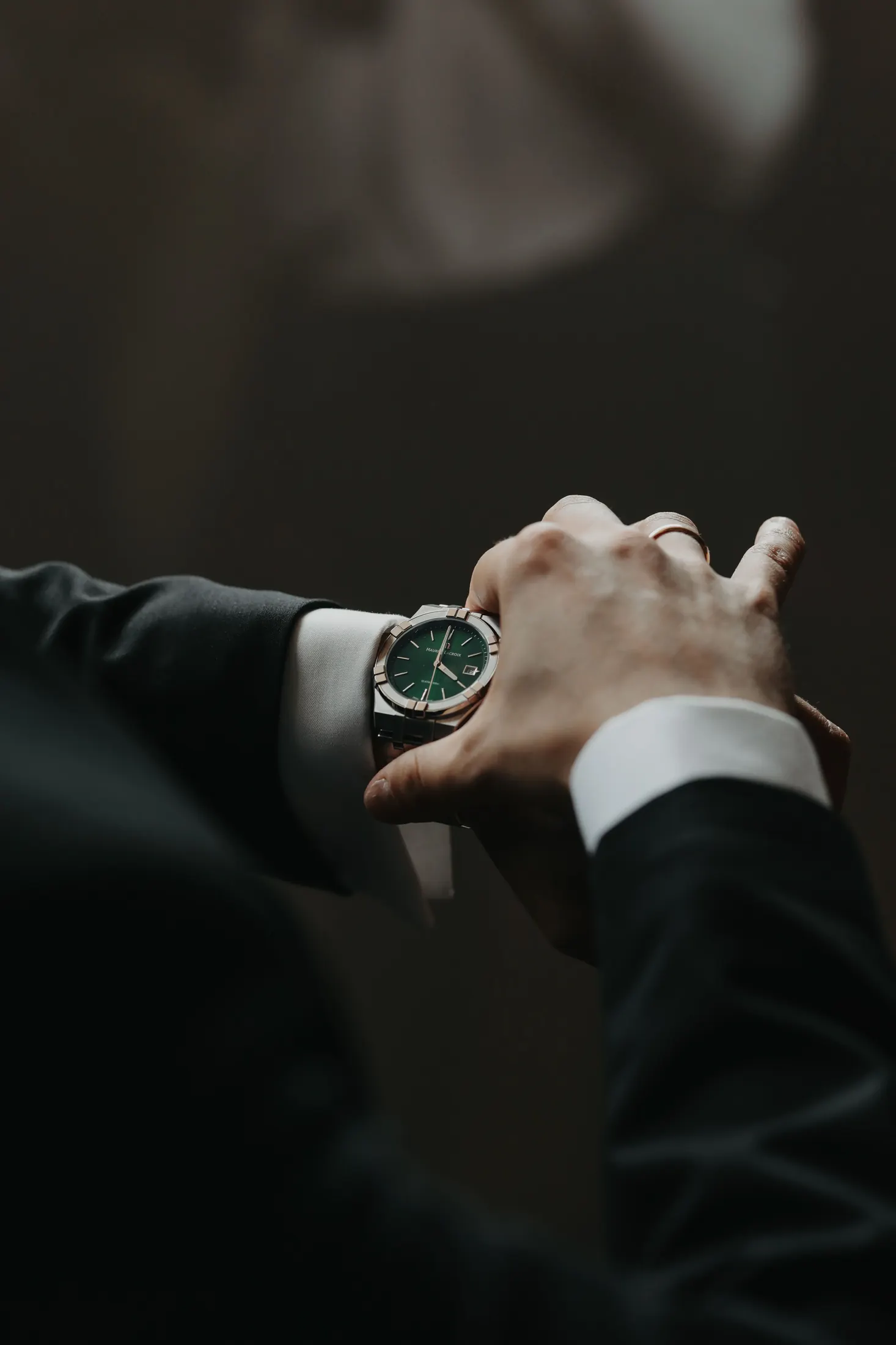 Luxury watch held for inspection during a private valuation